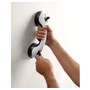 Handle fitted with suction pads